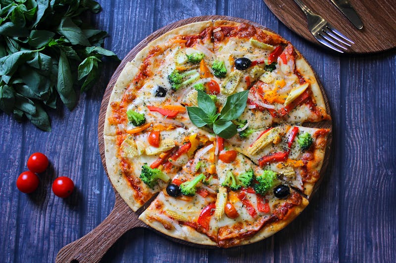 Fresh gourmet veggie pizza with colorful toppings