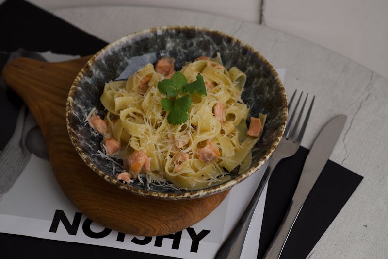 Fresh-made pasta arrabiata with herbs and parmesan