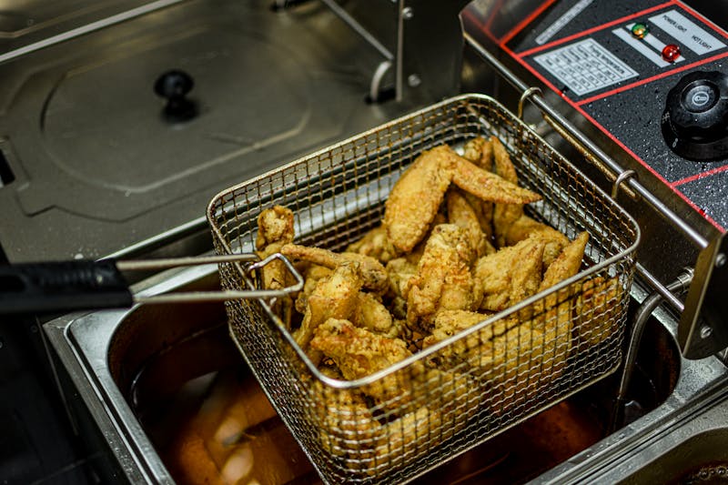 Crispy golden chicken wings served with dipping sauce